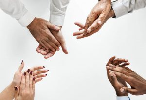 Four people showing hands